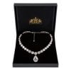 Coronation  crystal necklace inspired on Her Majesty Queen Elizabeth II original coronation necklace in a open black box with the gold lion and unicorn crest on the back lid thumbnail