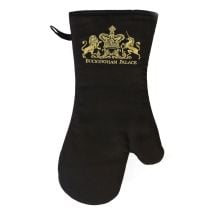 Buckingham Palace black cotton padded oven glove featuring a gold embroidered logo of a lion and unicorn royal crest and the words Buckingham Palace written under the crest. 