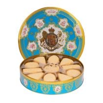 open tin of shortbread biscuits. The tin is decorated in a turquoise Coat of Arms design