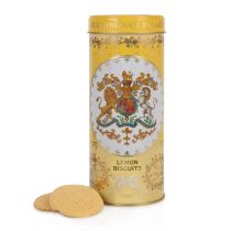 yellow tin with floral decoration and the crest and the centre of the tin. Stood next to a pile of lemon biscuits