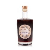 50 cl bottle of sloe gin. A clear glass bottle with a gold circular design on the front surrounded by sloe berries and other greenery 