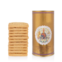 Gold tube tin of biscuits featuring the coat of arms. Next to a pile of shortbreads