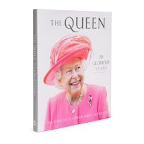 Front cover of The Queen 70 Glorious Years featuring a picture of The Queen in a pink outfit and hat