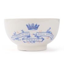 Cream earthenware cereal bowl with blue crown and banner stating property of the Royal kitchen