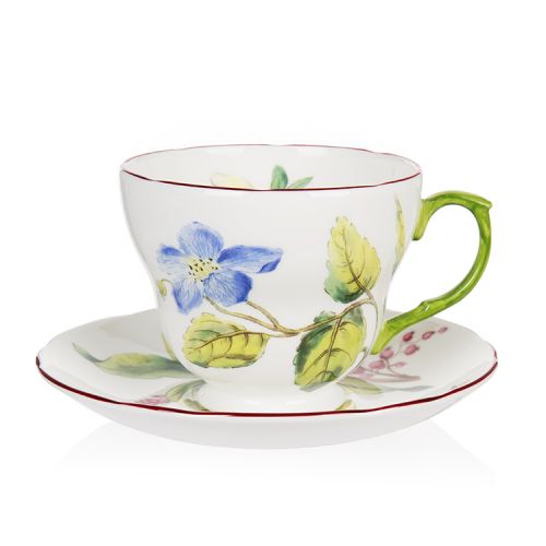 Chelsea fine bone china teacup and saucer with a design featuring  botanical paterns on both pieces and in the inner side of the cup. 