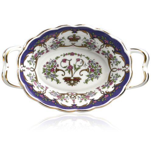 Queen Victoria fine bone china basket a with design featuring gold plated rims, Queen Victoria's name cipher on the inner side and floral patterns on the inner and outer sides. 
