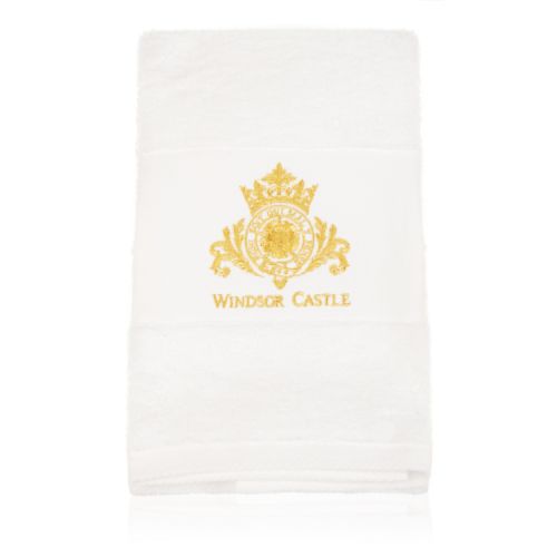 White hand towel embroidered gold crest and the words Windsor Castle