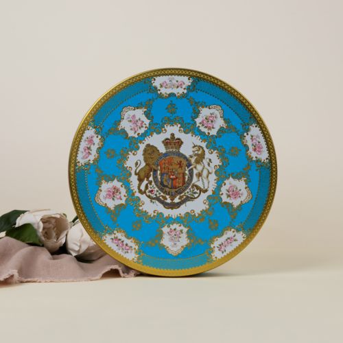 Open shot of the blue and gold round biscuit tin. The tin features the Royal Coat of Arms including a unicorn and a lion.