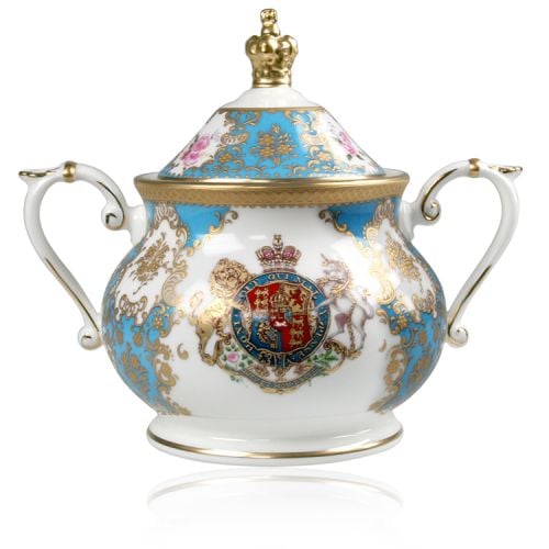 Royal coat of arms English fine bone china sugar bowl featuring a lion and unicorn royal crest surrounded by ornated gold patterns and English flower patterns on a turquoise blue coloured background. The lid is topped with with a royal gold crown. 