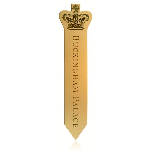 Buckingham palace gold leather bookmark featuring the words Buckingham Palace written across the bookmark and a gold royal crown on the side. 