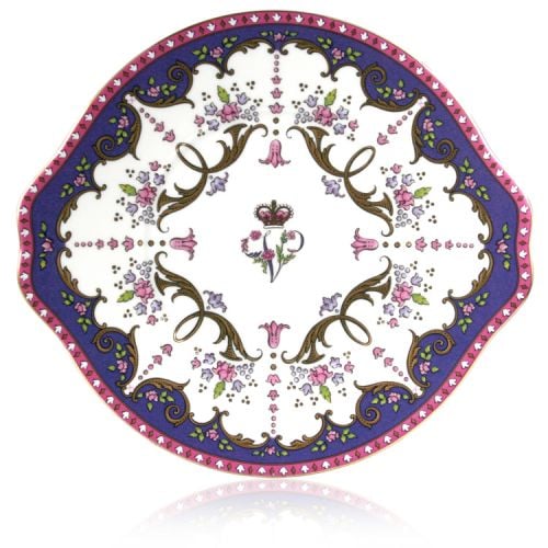 Queen Victoria sandwich plate with a design featuring Queen Victoria's name cipher surrounded by floral patterns and gold plated rim.