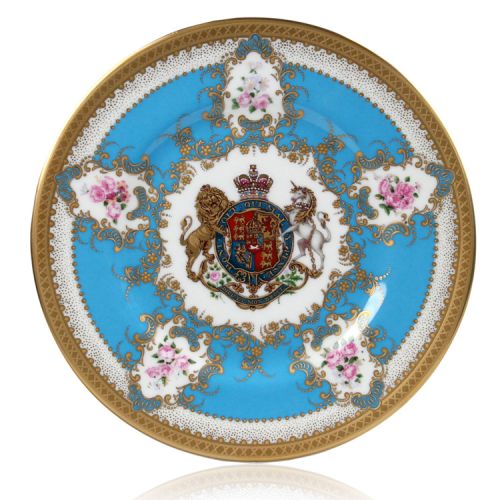 Royal coat of arms English fine bone china salad plate with gilded rims and featuring a lion and unicorn royal crest surrounded by ornated gold patterns and English flower patterns on a blue coloured background. 