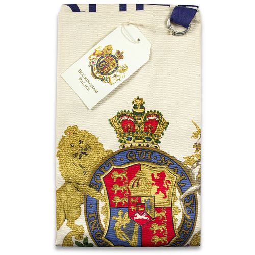 Buckingham Palace cotton apron featuring the words God Save The Queen written below the royal coat of arms 