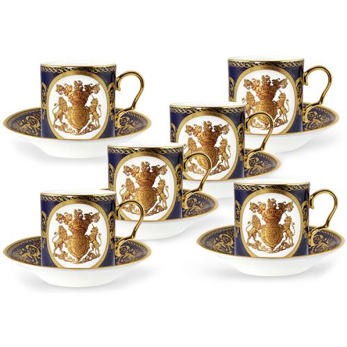 The full set of 6 English Fine Bone China lustre coffee cups and saucers featuring a gold hanoverian coat of arms surrounded by ornated patterns on a cobalt blue background and displayed in a giftbox. 