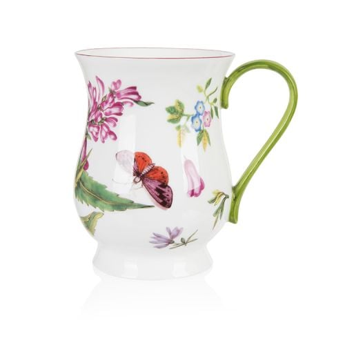 A white mug with the Chelsea Porcelain design printed on it. The design includes flowers and butterflies