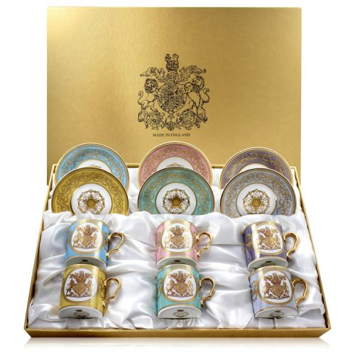 The full set of six English Fine Bone China lustre pastel coffee cups and saucers featuring a gold hanoverian coat of arms surrounded by gold ornated features on 6 different pastel coloured backgrounds and a presentation gift box. 