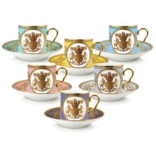 The full set of six English Fine Bone China lustre pastel coffee cups and saucers featuring a gold hanoverian coat of arms surrounded by gold ornated features on 6 different pastel coloured backgrounds and a presentation gift box. 