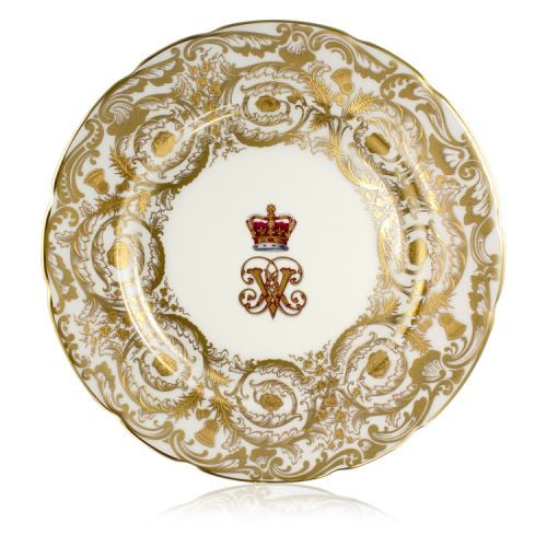 Victoria and Albert English fine bone china salad plate featuring the ciphers of Queen Victoria and Prince Albert surmounted by a royal crown and surrounded by intricately ornated gold patterns.