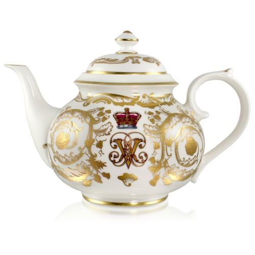 Victoria and Albert English fine bone china teapot featuring the ciphers of Queen Victoria and Prince Albert surmounted by a royal crown and surrounded by intricately ornated gold patterns.