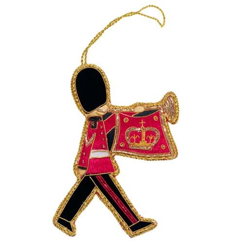 Marching guardsman with trumpet and flag decoration. Red and black material with gold thread surrounding. 