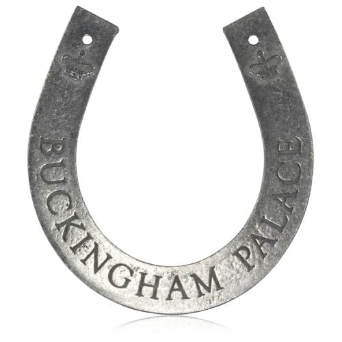 Royal Mews metal horseshoe with the words Buckingham Palace and royal crowns engraved on the back side and Royal Mews engraved on the front side. 