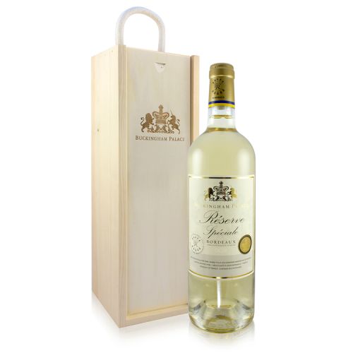 Wooden wine box with gold Buckingham Palace and motif stamped. Bottle of white wine with white and gold label. 