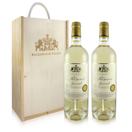 Wooden wine box with gold Buckingham Palace and motif stamped on. Two bottles of white wine are pictured next to it with white and gold labelling. 