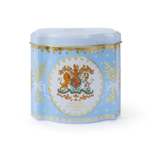 Blue tin tea caddy decorated with the Royal Coat of Arms, a crown, foliage with ribbons and a touch of gold.