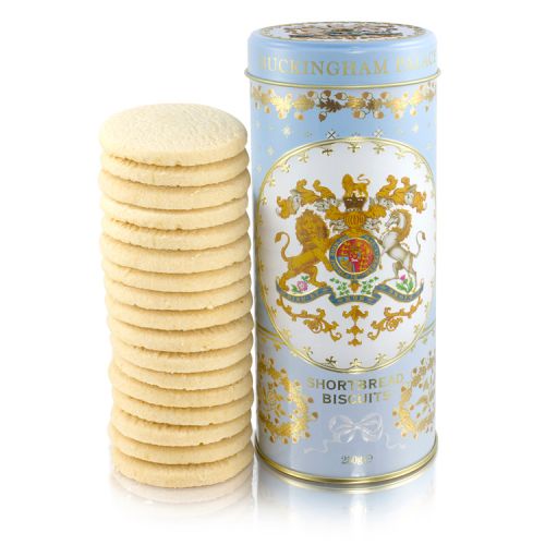 blue biscuit cylinder tin with crest on the front. Stood next to a pile of shortbread biscuits