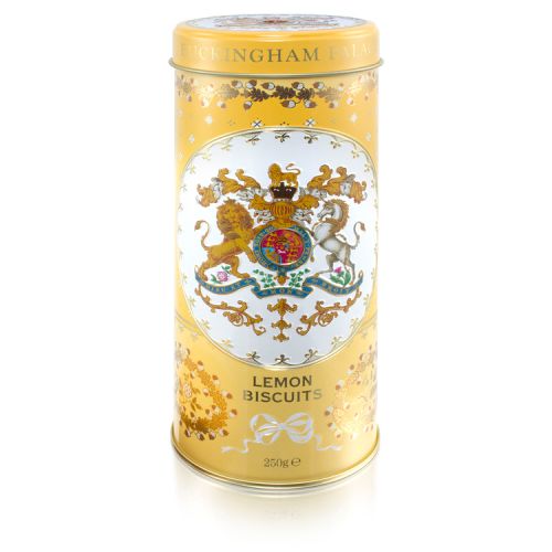 yellow tin with floral decoration and the crest and the centre of the tin. Stood next to a pile of lemon biscuits