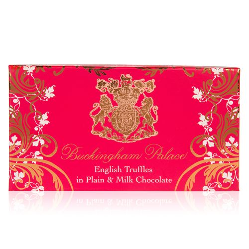 pink box of chocolate truffles with a gold swirl design and the crest at the centre of the design