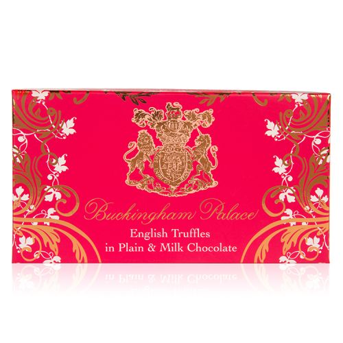 pink box of chocolate truffles with a gold swirl design and the crest at the centre of the design