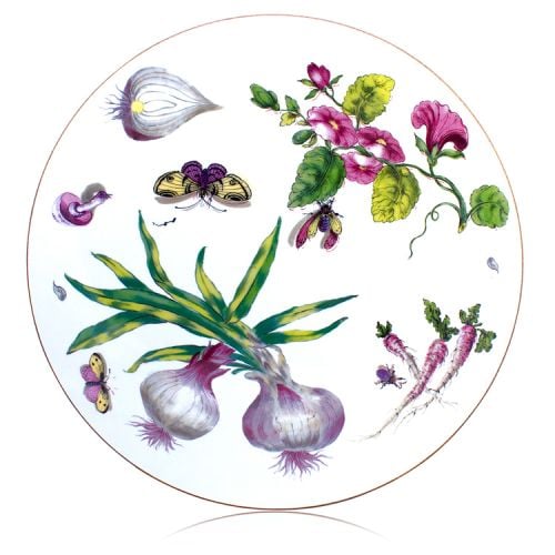 Circular table mat depicting a design of onions, leaves, butterflies