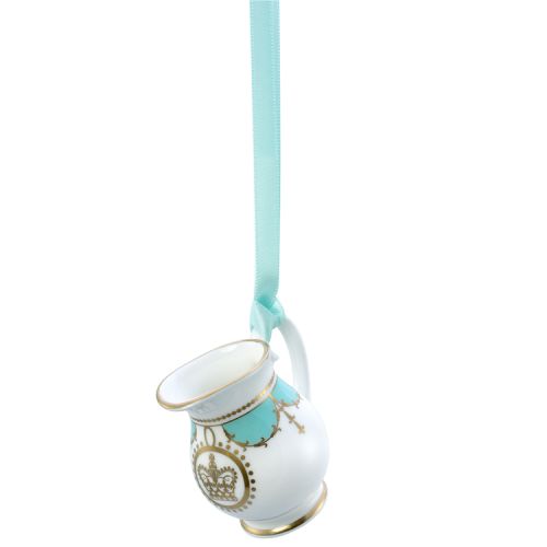 Miniature turquoise tankard with gold crown detail. It is  hanging from a turquoise ribbon