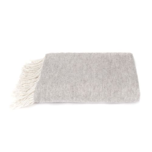 grey wool blanket with a white crest and the words 'Buckingham Palace' on the front