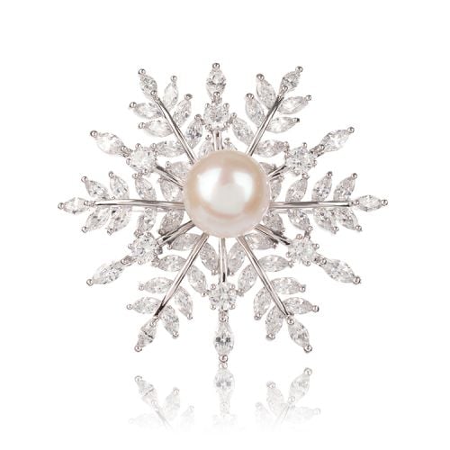 Snowflake crystal brooch with a pearl at the centre.