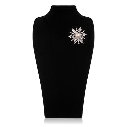 Snowflake crystal brooch with a pearl at the centre.