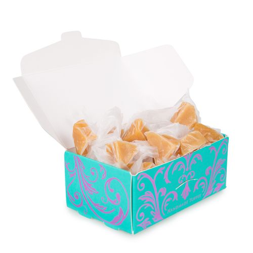 blue and purple box of toffees with a lion and unicorn crest. The words 'Buckingham Palace' are printed on top in purple writing