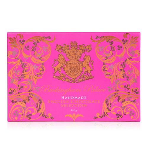 open box of chocolate selection in a pink box with gold swirl