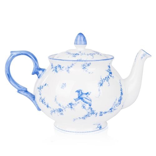 A white teapot with blue floral garland and bird design.