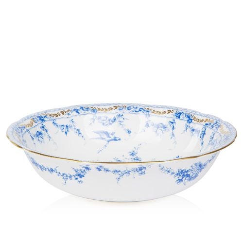 White bowl with a blue floral garland and bird design and finished with gold detail and gold edge of the bowl