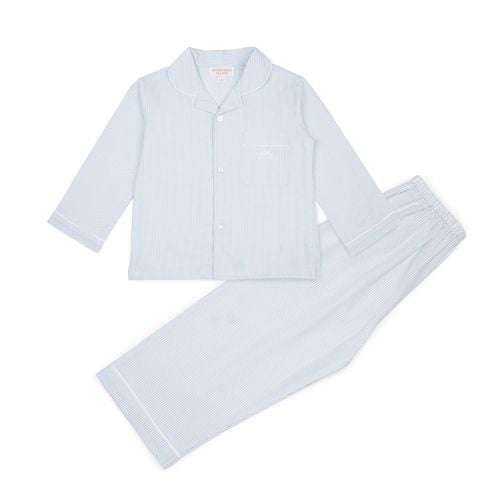 pale blue cotton pyjamas set. A blue shirt with white buttons up the front and pale blue cotton trousers 
