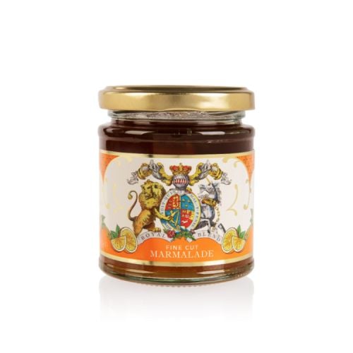 Glass jar of marmalade with a gold lid. Wrapped with an orange and white label showing the lion and unicorn crest