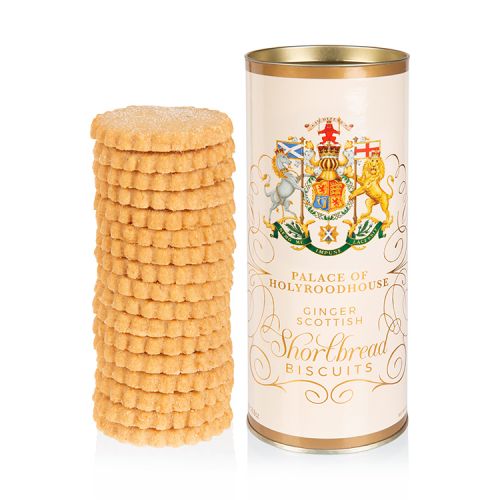 Cream biscuit tube featuring the Scottish coat of arms. Next to the tube is  pile of ginger shortbread biscuits.