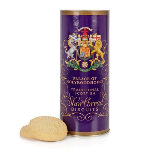 Purple tube of shortbread biscuits featuring the Scottish coat of arms. Next to the biscuit tube are two shortbread biscuits.