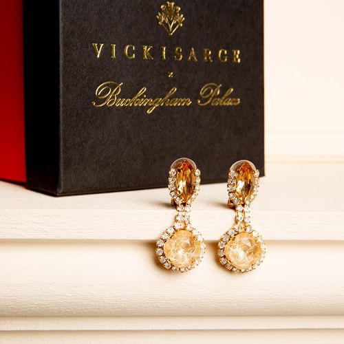 Champagne coloured crystal earrings surrounded by smaller clear crystals