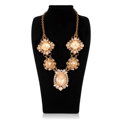 five champagne coloured crystal necklace on a gold chain displayed in an ornate design. All five crystals are arranged in a different design