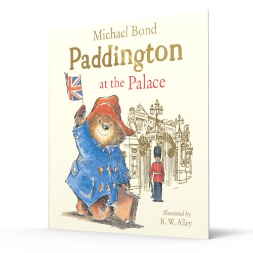 Front cover of a children's book of Paddington Bear waving a flag outside Buckingham Palace