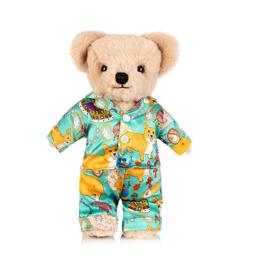 limited edition teddy bear dressed in silk Karen Mabon pyjamas in a turquoise corgi and other royal icons design