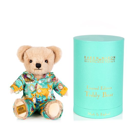 limited edition teddy bear dressed in silk Karen Mabon pyjamas in a turquoise corgi and other royal icons design